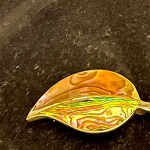 Brooche ,shell looking, stamped but too small to see.